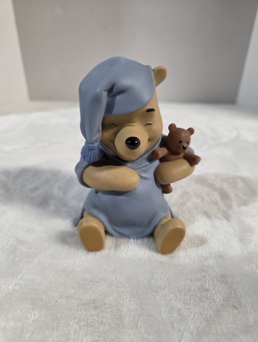 Night Time Winnie The Pooh Holding A Teddy Bear In His Blue PJs